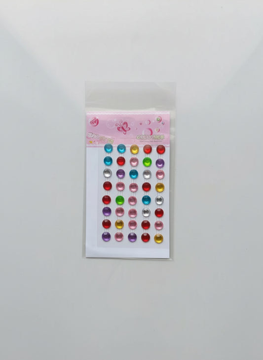 Pack of colorful self adhesive stones on a white background